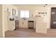 Modern kitchen boasts white cabinets, stainless steel appliances, and a center island at 4277 Rimcrest Rd, Las Vegas, NV 89121