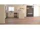 Modern kitchen with stainless appliances, island, and a built-in modern electric fireplace at 4277 Rimcrest Rd, Las Vegas, NV 89121