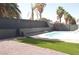 Backyard pool area features a refreshing in-ground pool, artificial turf, and ample space for outdoor relaxation at 4277 Rimcrest Rd, Las Vegas, NV 89121