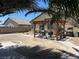 Backyard featuring a covered outdoor kitchen area, and desert landscaping at 4620 Ventana Rey St, North Las Vegas, NV 89081
