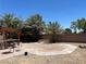 Backyard area showcasing the desert landscaping, outdoor kitchen and desert trees at 4620 Ventana Rey St, North Las Vegas, NV 89081