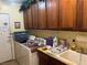 Laundry room with washer, dryer, storage cabinets and a sink at 4620 Ventana Rey St, North Las Vegas, NV 89081