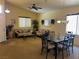 Comfortable living room featuring dual sofas, natural light, and a dining table perfect for gatherings at 4620 Ventana Rey St, North Las Vegas, NV 89081