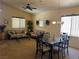 Cozy living room with comfortable seating, a dining area, and warm, natural light at 4620 Ventana Rey St, North Las Vegas, NV 89081