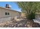 Spacious backyard with mature trees, providing shade and privacy at 4825 Stillwater Ave, Las Vegas, NV 89110