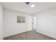 Minimalist bedroom with a window and doorway at 4825 Stillwater Ave, Las Vegas, NV 89110