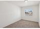 Bright bedroom with carpeted floors and a large window providing natural light at 4825 Stillwater Ave, Las Vegas, NV 89110