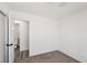 A modest bedroom with an open door to a nearby bathroom at 4825 Stillwater Ave, Las Vegas, NV 89110