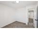 Plain bedroom featuring a doorway to another carpeted room at 4825 Stillwater Ave, Las Vegas, NV 89110