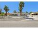 Charming single-story home with desert landscaping and mature palm trees at 4825 Stillwater Ave, Las Vegas, NV 89110