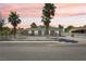 Charming single-story home with desert landscaping, palm trees, and a fenced front yard at 4825 Stillwater Ave, Las Vegas, NV 89110