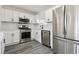Close up shot of bright kitchen with stainless steel appliances and modern design at 4825 Stillwater Ave, Las Vegas, NV 89110