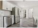 Contemporary kitchen featuring stainless steel appliances, white cabinets and subway tile backsplash at 4825 Stillwater Ave, Las Vegas, NV 89110
