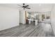Spacious living room showing the kitchen, island seating and lots of sunlight at 4825 Stillwater Ave, Las Vegas, NV 89110