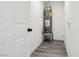 Compact utility room featuring a modern water heater and gray flooring at 4825 Stillwater Ave, Las Vegas, NV 89110