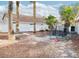 Spacious backyard featuring palm trees, a trampoline, and a white fence at 4848 Cutting Diamond Ct, North Las Vegas, NV 89081