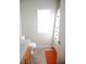 Bathroom with tiled floor, wood cabinet, and window with natural light at 4848 Cutting Diamond Ct, North Las Vegas, NV 89081