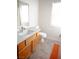 Bathroom view featuring a wood cabinet and orange floor mat at 4848 Cutting Diamond Ct, North Las Vegas, NV 89081