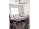 Bedroom with stuffed animals on a bed and hardwood flooring at 4848 Cutting Diamond Ct, North Las Vegas, NV 89081