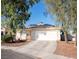Inviting single-story home with a tile roof, two-car garage, and desert landscaping at 4848 Cutting Diamond Ct, North Las Vegas, NV 89081