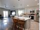 Bright kitchen with an island, light countertops, and an open view to the living room at 4848 Cutting Diamond Ct, North Las Vegas, NV 89081