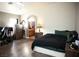 Cozy main bedroom with wood-look floors and archway to bathroom at 4848 Cutting Diamond Ct, North Las Vegas, NV 89081