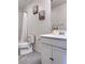Bathroom featuring gray tile floor, shower/tub combo, toilet, vanity with cabinet at 4993 Birchland Manor Ave, Las Vegas, NV 89139