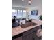 Bright kitchen with granite countertops, stainless steel sink, and open to the living area at 4993 Birchland Manor Ave, Las Vegas, NV 89139
