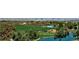Expansive view of the golf course and pond with the Las Vegas skyline in the distance at 5 Clear Crossing Trl, Henderson, NV 89052