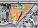 Aerial view of property featuring a pool, palm trees, and a tile roof enclosed by a blue border at 5033 Austrian Dr, Las Vegas, NV 89130