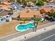 Aerial view of a single-story home featuring a backyard swimming pool and desert landscaping at 5033 Austrian Dr, Las Vegas, NV 89130