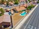 Aerial view of home with a private pool, a low-maintenance yard and street access at 5033 Austrian Dr, Las Vegas, NV 89130