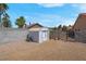 Backyard with a shed, enclosed by a block wall with secure gated access to the side yard at 5033 Austrian Dr, Las Vegas, NV 89130