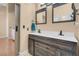Bathroom with double sink vanity, dark wood cabinets, and a modern, elegant design at 5033 Austrian Dr, Las Vegas, NV 89130