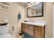 Bathroom featuring a wood vanity with drawers, a white countertop, and modern fixtures at 5033 Austrian Dr, Las Vegas, NV 89130