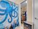 Bathroom featuring an octopus shower curtain and a view into a walk-in closet at 5033 Austrian Dr, Las Vegas, NV 89130