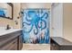 Bathroom with a decorative shower curtain and modern fixtures at 5033 Austrian Dr, Las Vegas, NV 89130