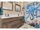 Bathroom featuring double sinks and nautical-themed shower curtain at 5033 Austrian Dr, Las Vegas, NV 89130