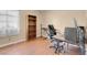 Bedroom featuring hardwood floors and a desk set up at 5033 Austrian Dr, Las Vegas, NV 89130