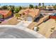Exterior of a charming single-story home featuring a terra cotta roof and low-maintenance desert landscaping at 5033 Austrian Dr, Las Vegas, NV 89130