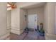 Covered front porch with neutral-colored exterior and decorative potted plants at 5033 Austrian Dr, Las Vegas, NV 89130