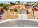 Charming home with desert landscaping, tile roof, and a two-car garage at 5033 Austrian Dr, Las Vegas, NV 89130