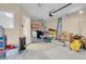 Spacious garage featuring laundry, utility closet, and lots of storage at 5033 Austrian Dr, Las Vegas, NV 89130