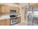 Well-lit kitchen featuring stainless steel appliances and modern upgrades at 5033 Austrian Dr, Las Vegas, NV 89130