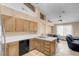 Charming kitchen features wood cabinets, white tile countertops, and stainless steel appliances at 5033 Austrian Dr, Las Vegas, NV 89130