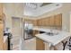 Bright kitchen featuring stainless steel appliances and breakfast bar at 5033 Austrian Dr, Las Vegas, NV 89130