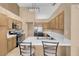 Spacious kitchen with stainless steel appliances, tile countertops and eat-in seating at 5033 Austrian Dr, Las Vegas, NV 89130