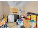 A laundry room with a washer, dryer, water heater, and storage at 5033 Austrian Dr, Las Vegas, NV 89130