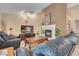 Inviting living room with a cozy fireplace and comfortable leather seating arrangement at 5033 Austrian Dr, Las Vegas, NV 89130