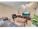 Comfortable living room with stylish decor, leather furniture, and a large TV at 5033 Austrian Dr, Las Vegas, NV 89130